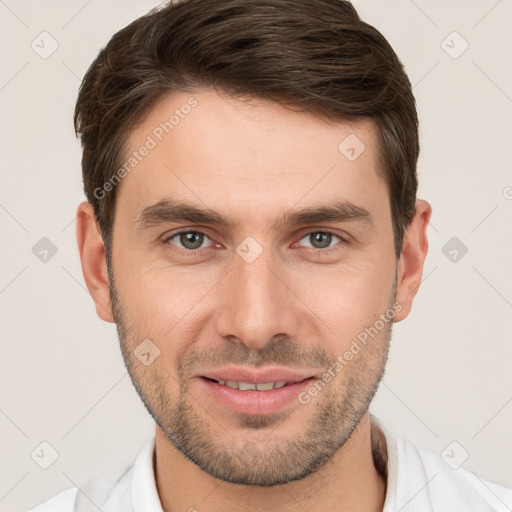 Joyful white young-adult male with short  brown hair and brown eyes