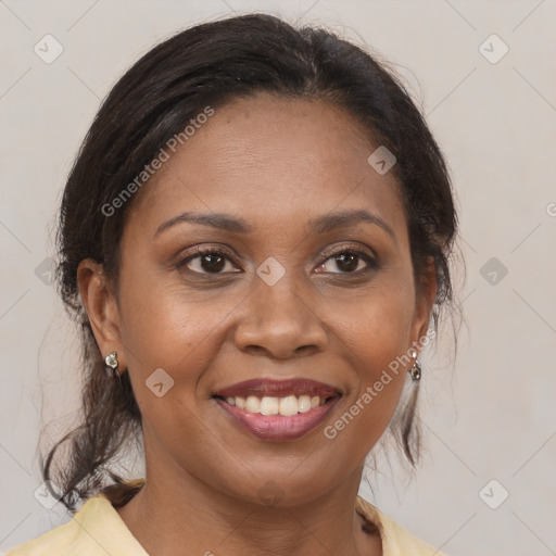 Joyful black young-adult female with medium  brown hair and brown eyes