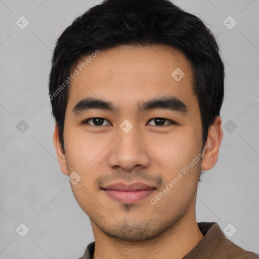 Joyful asian young-adult male with short  black hair and brown eyes