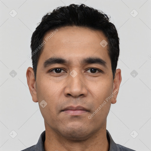 Neutral latino young-adult male with short  black hair and brown eyes