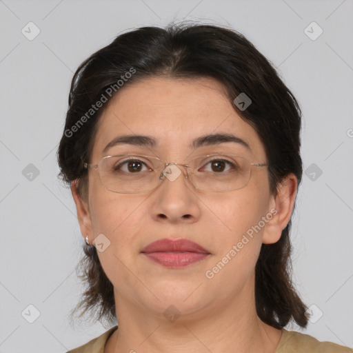 Joyful white adult female with medium  brown hair and brown eyes