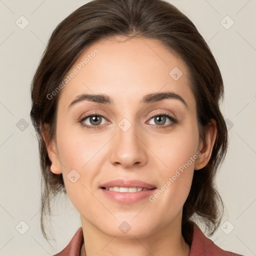 Joyful white young-adult female with medium  brown hair and grey eyes