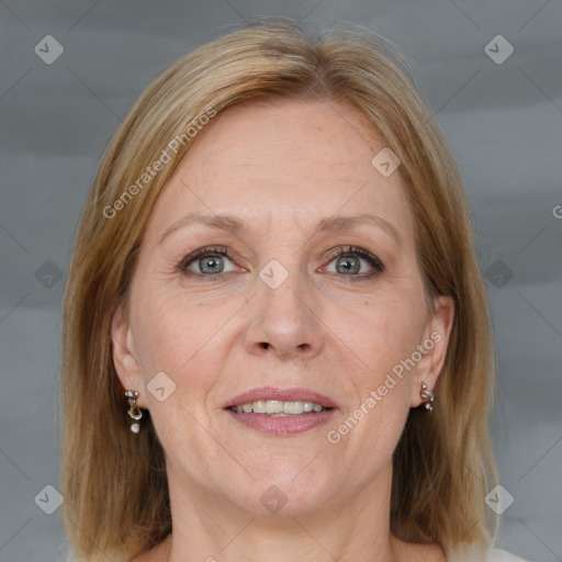 Joyful white adult female with medium  brown hair and grey eyes