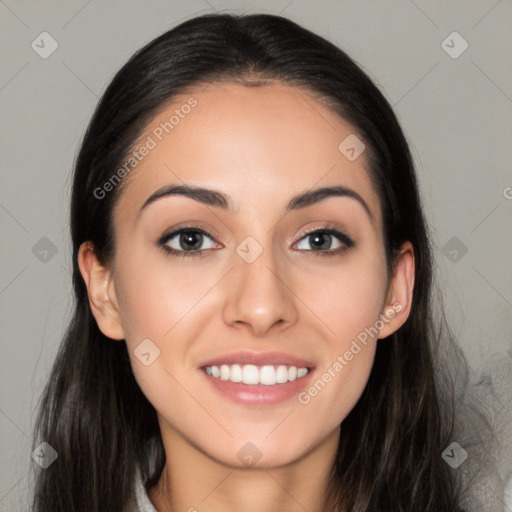 Joyful white young-adult female with long  black hair and brown eyes