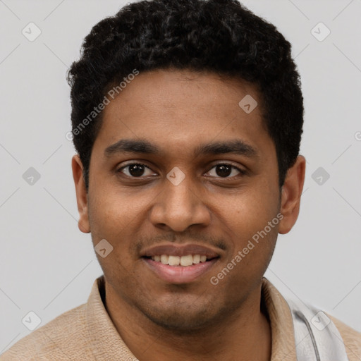 Joyful black young-adult male with short  black hair and brown eyes