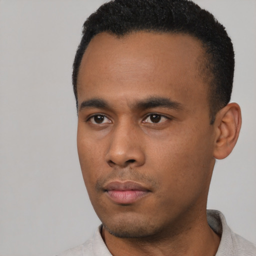 Neutral latino young-adult male with short  black hair and brown eyes