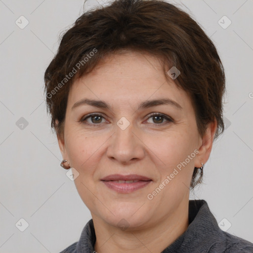 Joyful white adult female with short  brown hair and brown eyes