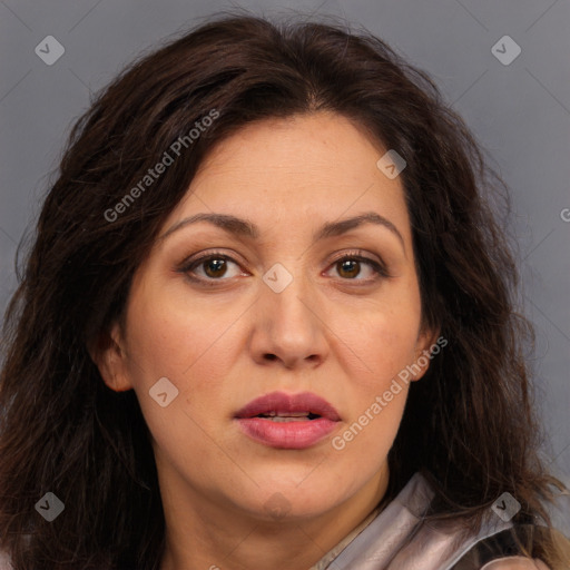 Joyful white adult female with long  brown hair and brown eyes