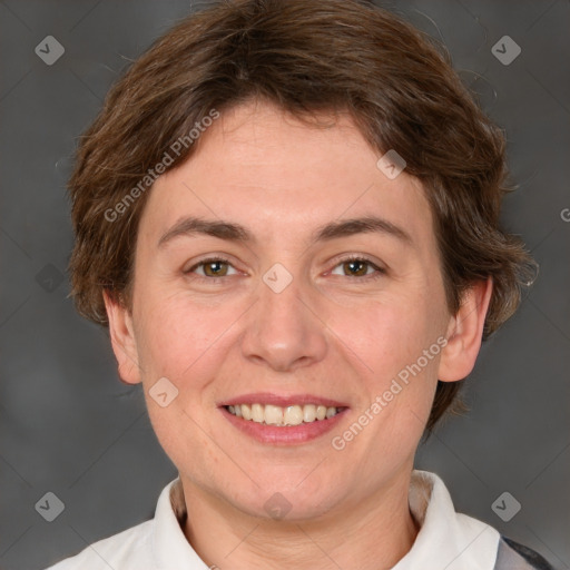 Joyful white adult female with short  brown hair and grey eyes