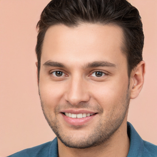 Joyful white young-adult male with short  brown hair and brown eyes