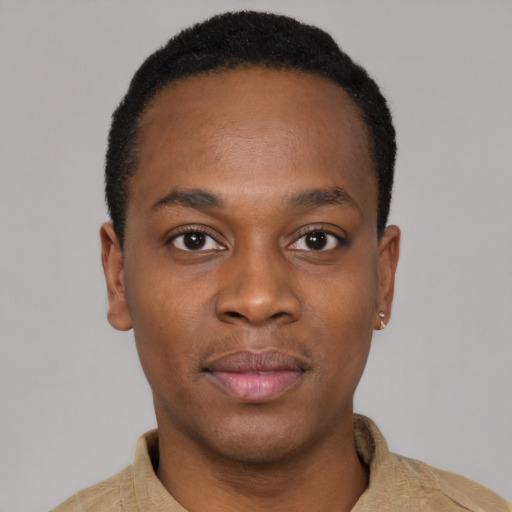 Joyful black young-adult male with short  black hair and brown eyes
