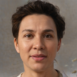 Joyful white adult female with short  brown hair and brown eyes