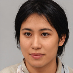 Joyful asian young-adult female with medium  brown hair and brown eyes