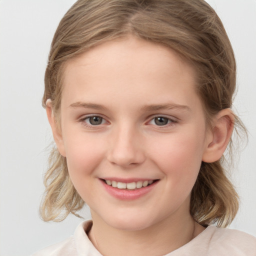 Joyful white child female with medium  brown hair and grey eyes