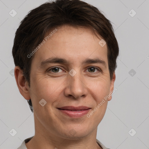 Joyful white adult male with short  brown hair and grey eyes