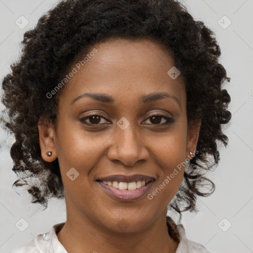 Joyful black young-adult female with medium  brown hair and brown eyes