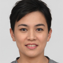 Joyful asian young-adult female with short  black hair and brown eyes