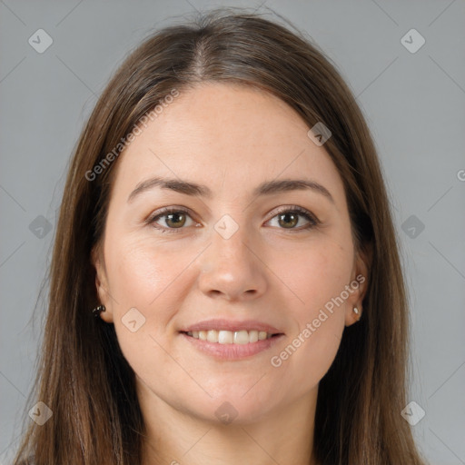 Joyful white young-adult female with long  brown hair and brown eyes