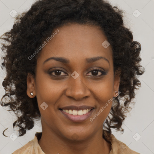 Joyful black young-adult female with medium  brown hair and brown eyes