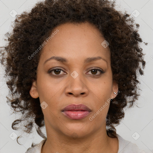 Joyful black adult female with short  brown hair and brown eyes