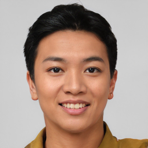 Joyful asian young-adult female with short  black hair and brown eyes