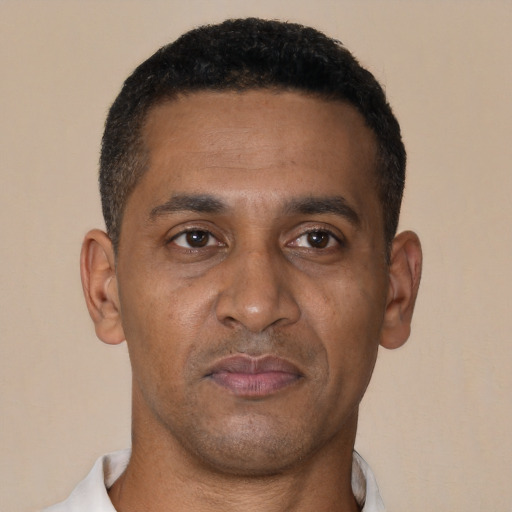 Neutral black adult male with short  brown hair and brown eyes