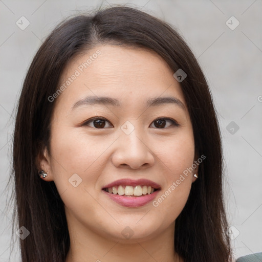 Joyful asian young-adult female with long  brown hair and brown eyes