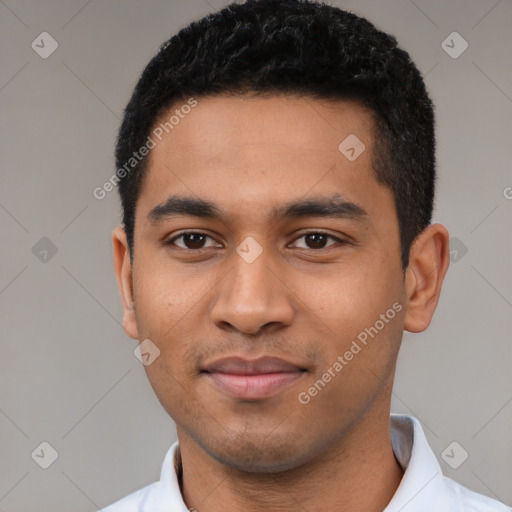 Joyful latino young-adult male with short  black hair and brown eyes