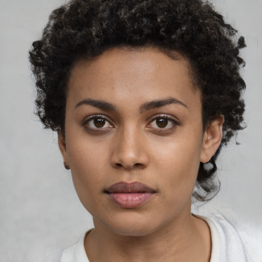 Neutral black young-adult female with short  brown hair and brown eyes