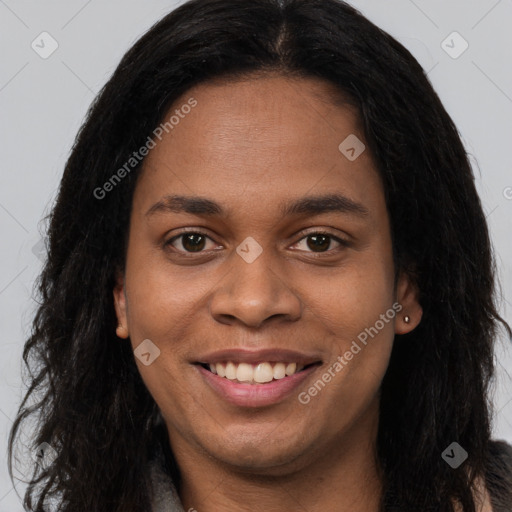 Joyful black young-adult female with long  brown hair and brown eyes