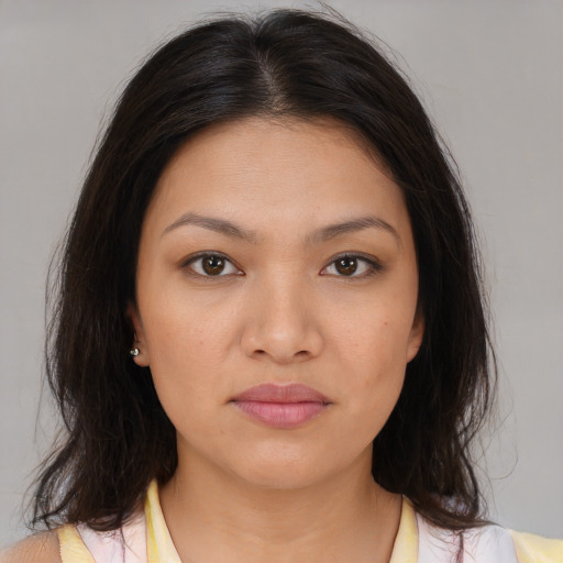 Joyful asian young-adult female with medium  brown hair and brown eyes