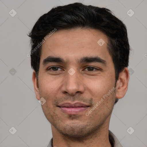 Joyful white young-adult male with short  black hair and brown eyes