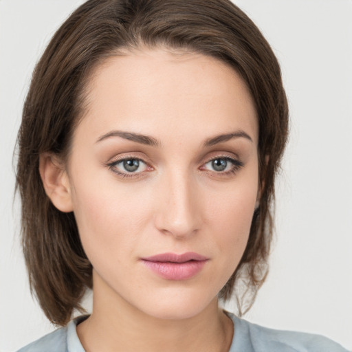 Neutral white young-adult female with medium  brown hair and grey eyes