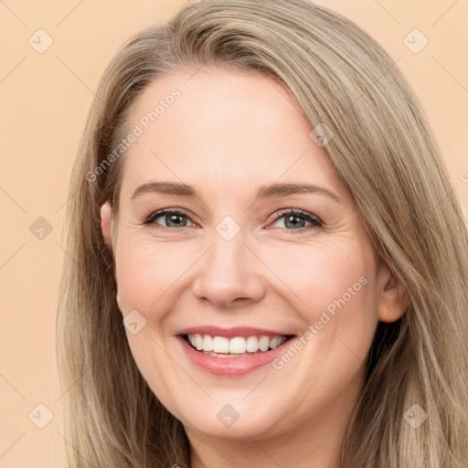 Joyful white young-adult female with long  brown hair and green eyes