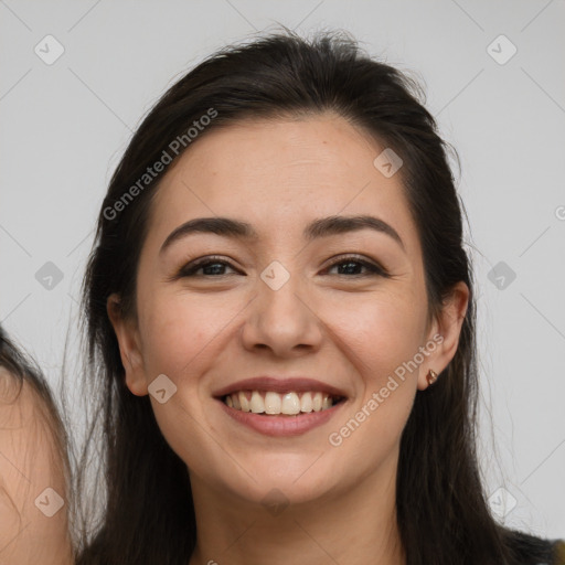 Joyful white young-adult female with long  brown hair and brown eyes