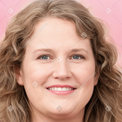 Joyful white young-adult female with long  brown hair and blue eyes