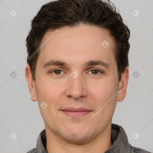 Joyful white adult male with short  brown hair and grey eyes