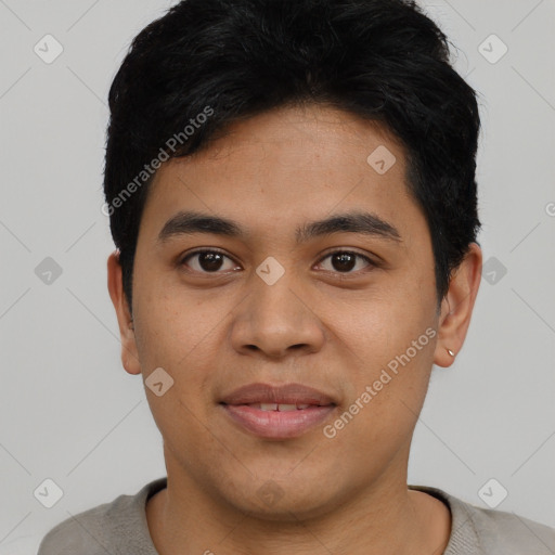 Joyful asian young-adult male with short  black hair and brown eyes