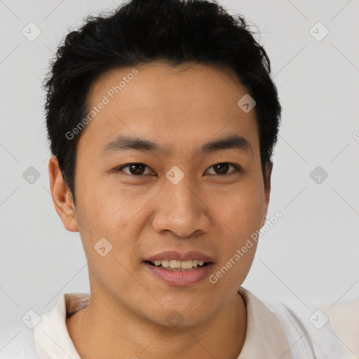 Joyful asian young-adult male with short  brown hair and brown eyes