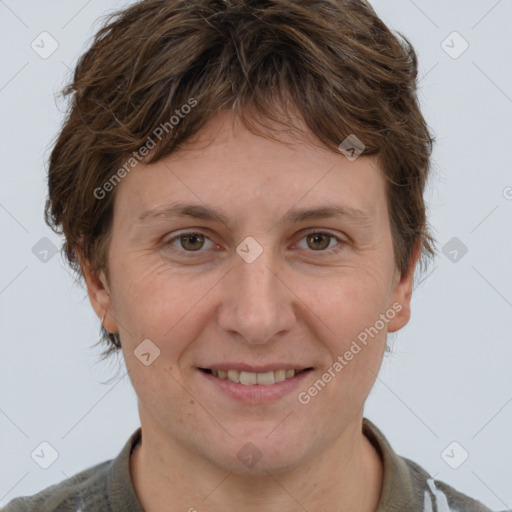 Joyful white adult female with short  brown hair and grey eyes