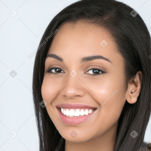 Joyful latino young-adult female with long  brown hair and brown eyes