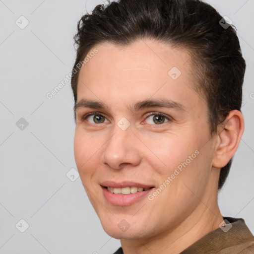 Joyful white adult male with short  brown hair and brown eyes