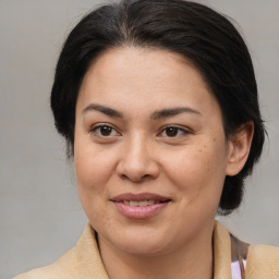 Joyful white young-adult female with medium  brown hair and brown eyes