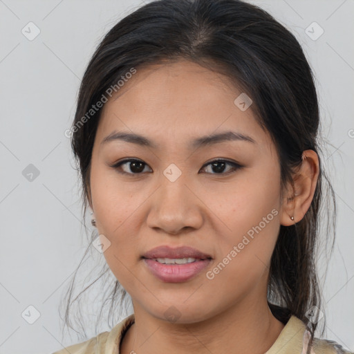 Joyful latino young-adult female with medium  brown hair and brown eyes