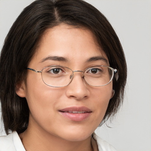 Joyful white young-adult female with medium  brown hair and brown eyes