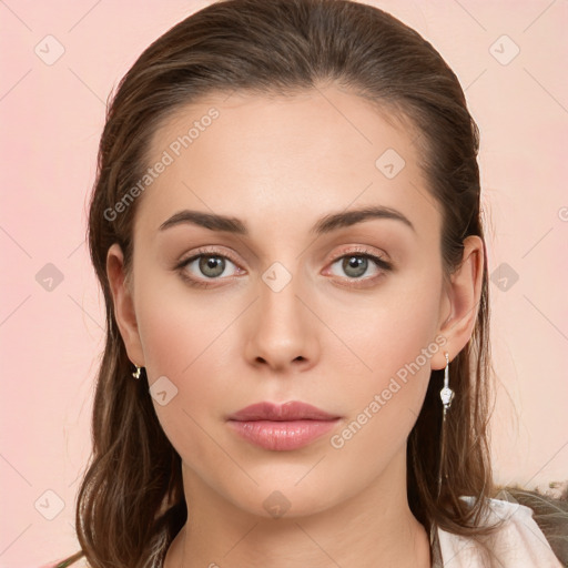 Neutral white young-adult female with long  brown hair and brown eyes