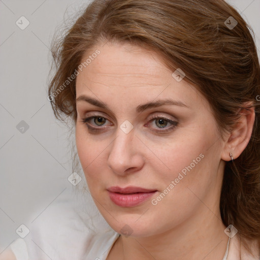 Joyful white young-adult female with long  brown hair and blue eyes