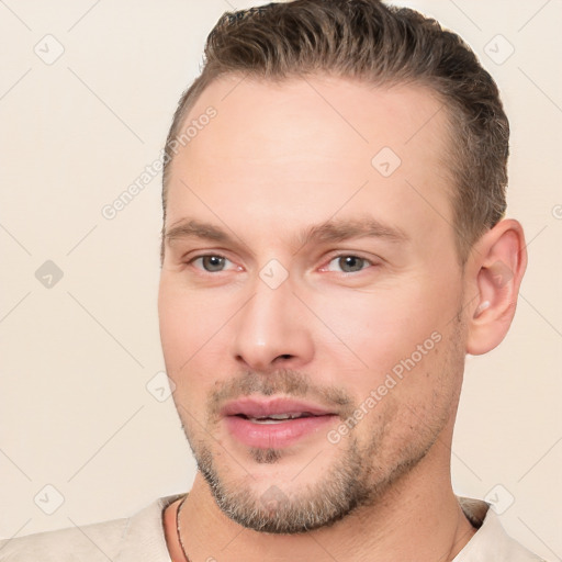 Joyful white young-adult male with short  brown hair and brown eyes