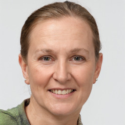 Joyful white adult female with short  brown hair and grey eyes