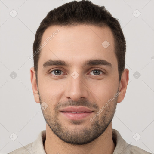 Joyful white young-adult male with short  brown hair and brown eyes